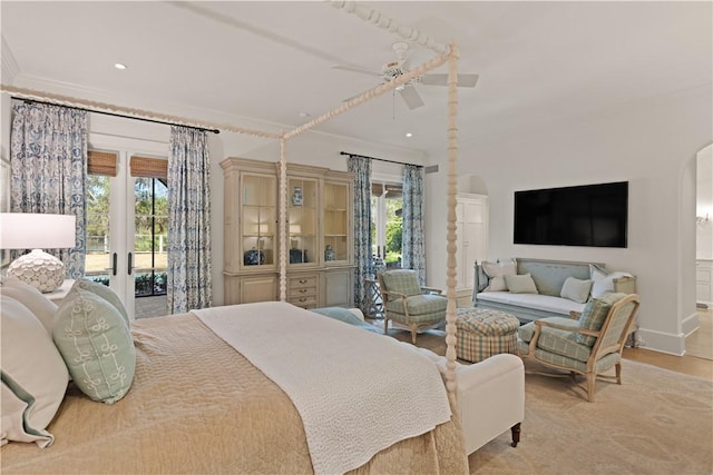 bedroom with light wood-type flooring, access to outside, ceiling fan, and ornamental molding