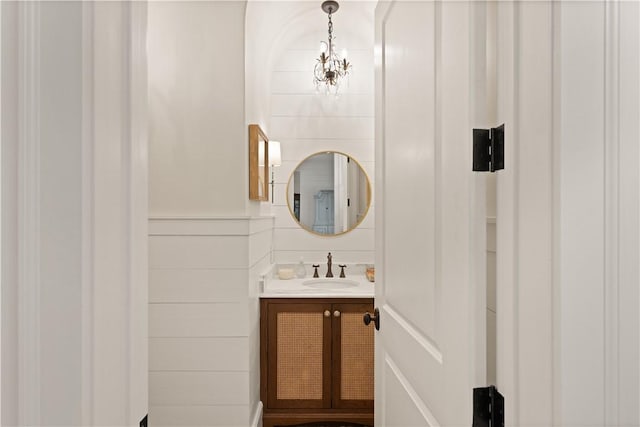 bathroom featuring vanity and a chandelier