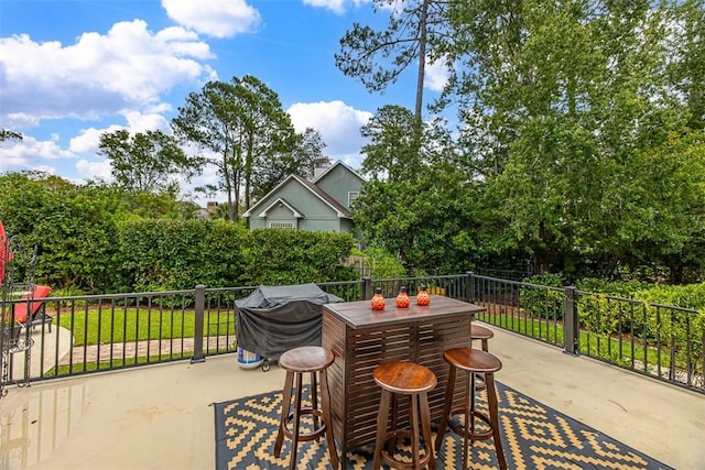 view of patio featuring a grill