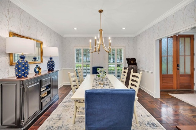 dining room with french doors, dark parquet floors, an inviting chandelier, and crown molding