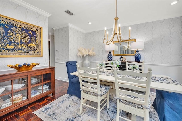 dining space with a notable chandelier, ornamental molding, and dark parquet floors