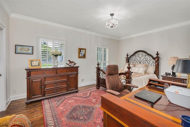 bedroom with dark hardwood / wood-style floors, an inviting chandelier, and crown molding