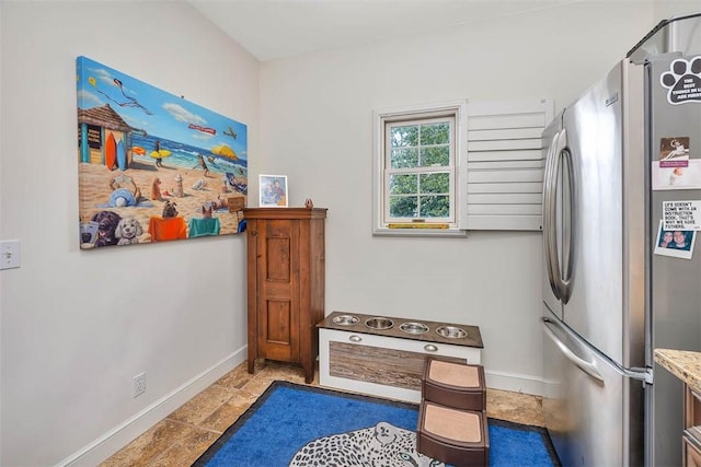 interior space featuring stainless steel refrigerator