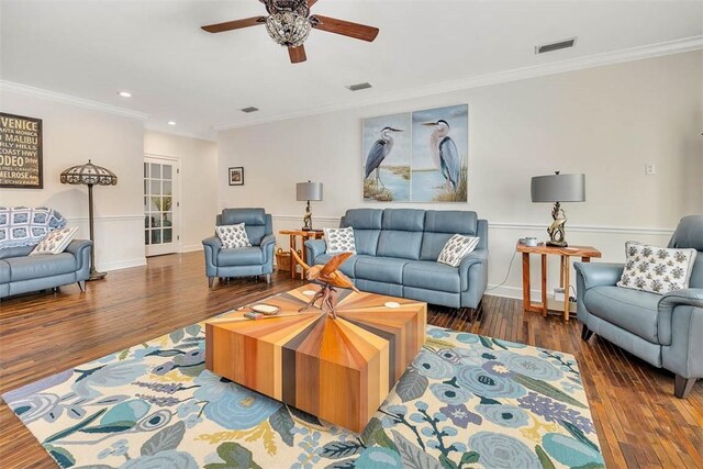 living room with crown molding, ceiling fan, and dark hardwood / wood-style floors