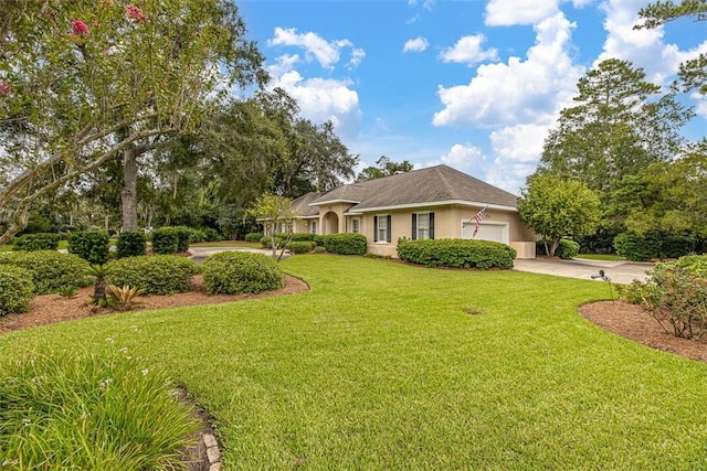 ranch-style home with a front yard and a garage