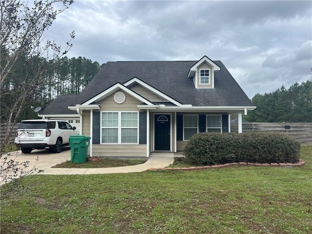 view of front of home featuring a garage and a front yard