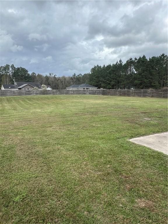 view of yard with a rural view