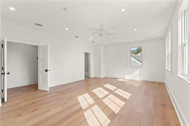 unfurnished room with ceiling fan and light hardwood / wood-style floors