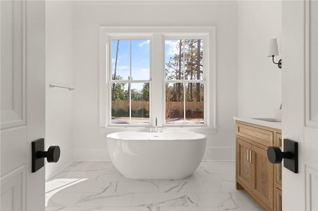 bathroom with vanity and a bathtub