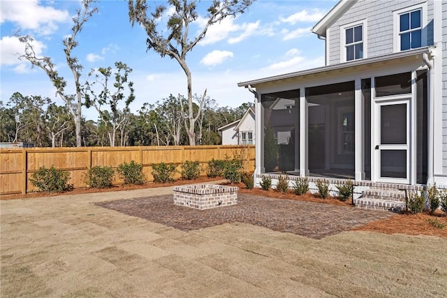 view of patio with a sunroom