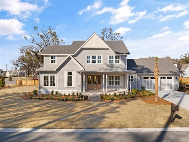 view of front of property with a porch and a garage