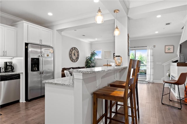 kitchen with stainless steel appliances, recessed lighting, and wood finished floors