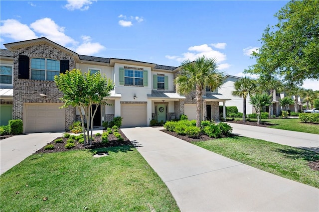 view of property featuring a garage and a front yard