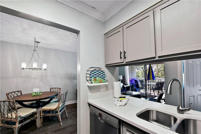 kitchen with dishwasher, hanging light fixtures, light countertops, a chandelier, and a sink