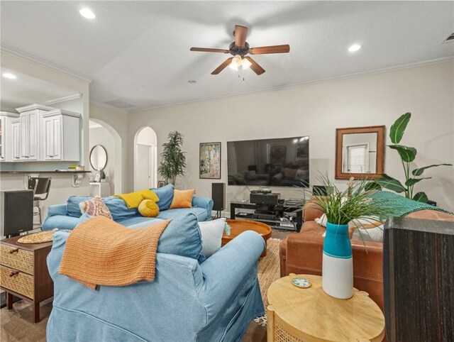 dining space featuring hardwood / wood-style flooring, ceiling fan with notable chandelier, crown molding, and a wealth of natural light