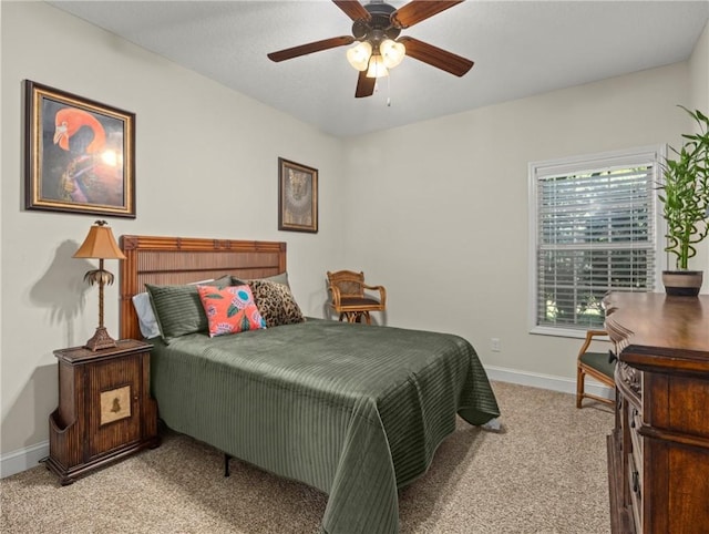 bedroom with ceiling fan and light colored carpet