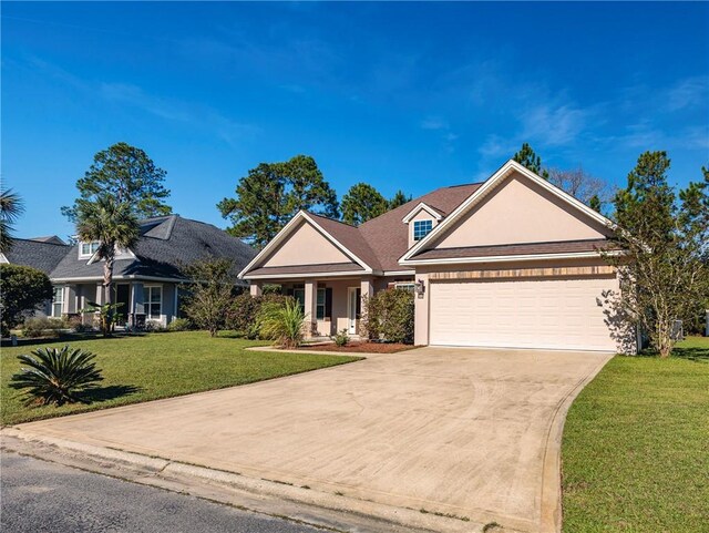 view of front of property with a garage and a front lawn