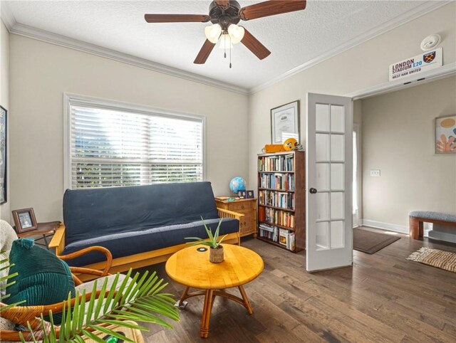 entryway featuring a textured ceiling, dark hardwood / wood-style flooring, and crown molding