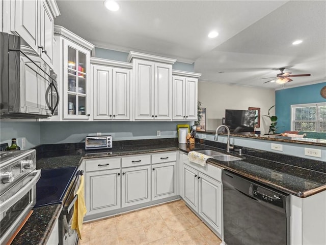 kitchen with white cabinetry, sink, ceiling fan, dark stone countertops, and black appliances