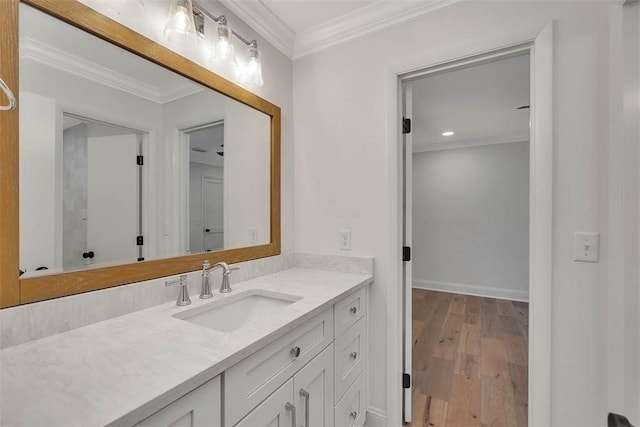 217 Five Pounds Rd, Saint Simons Island, GA 31522 - bathroom featuring vanity, wood finished floors, ornamental molding, and baseboards