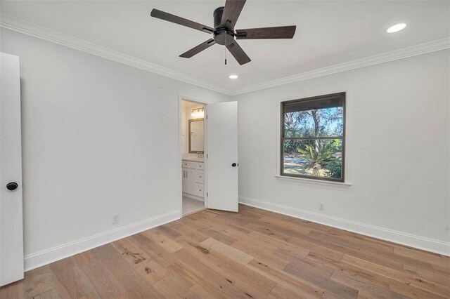 217 Five Pounds Rd, Saint Simons Island, GA 31522 - unfurnished bedroom with baseboards, light wood-style floors, crown molding, recessed lighting, and connected bathroom