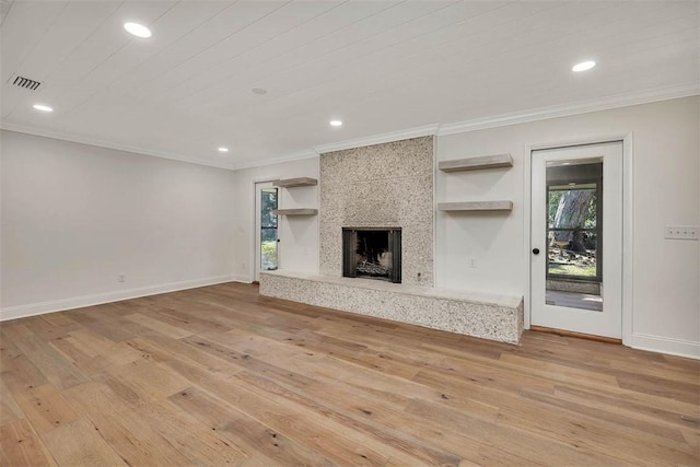 217 Five Pounds Rd, Saint Simons Island, GA 31522 - unfurnished living room with light wood-type flooring, healthy amount of natural light, crown molding, recessed lighting, and baseboards