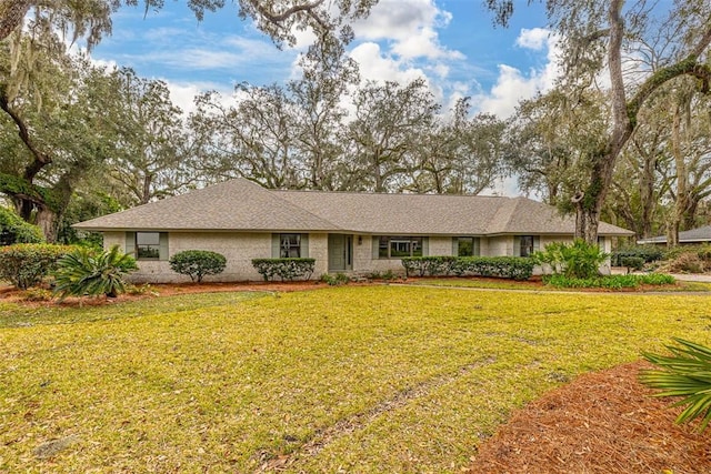 217 Five Pounds Rd, Saint Simons Island, GA 31522 - ranch-style house featuring a front yard