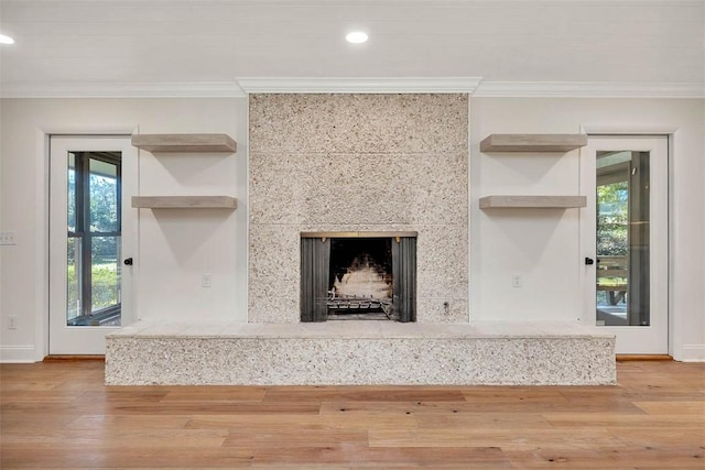 217 Five Pounds Rd, Saint Simons Island, GA 31522 - detailed view of ornamental molding, recessed lighting, wood finished floors, a fireplace, and baseboards