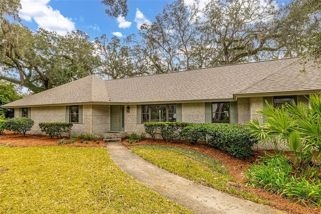 217 Five Pounds Rd, Saint Simons Island, GA 31522 - single story home featuring a front yard and a shingled roof
