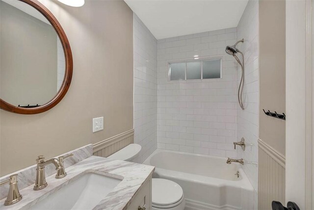 111 Youngwood Dr, Saint Simons Island, GA 31522 - full bath featuring vanity, bathing tub / shower combination, and a wainscoted wall
