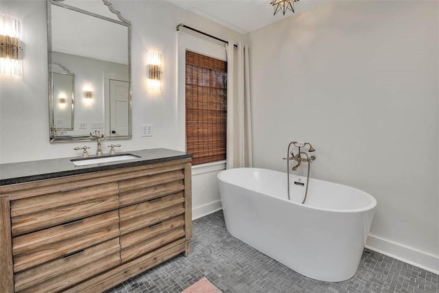 111 Youngwood Dr, Saint Simons Island, GA 31522 - full bath featuring a freestanding tub, vanity, and tile patterned flooring