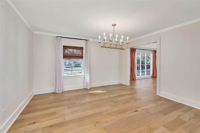 111 Youngwood Dr, Saint Simons Island, GA 31522 - unfurnished room with ornamental molding, a chandelier, and light wood finished floors