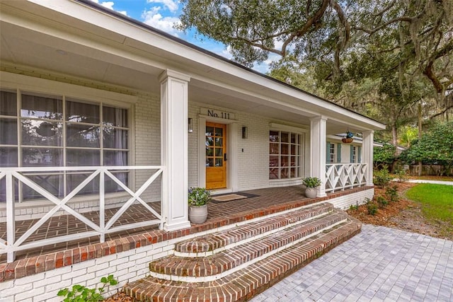 111 Youngwood Dr, Saint Simons Island, GA 31522 - property entrance with a porch and brick siding