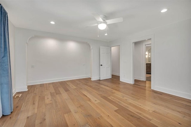 111 Youngwood Dr, Saint Simons Island, GA 31522 - unfurnished bedroom featuring arched walkways, light wood-type flooring, recessed lighting, and ceiling fan