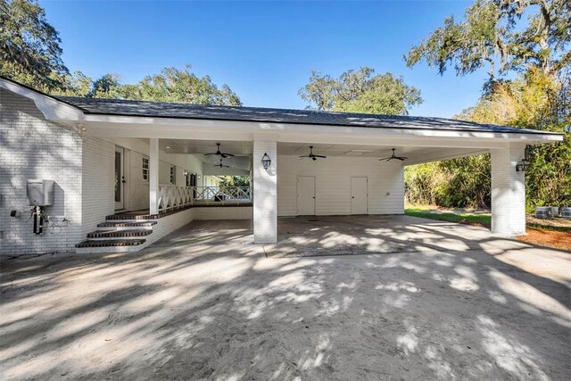 111 Youngwood Dr, Saint Simons Island, GA 31522 - view of car parking with ceiling fan, an attached carport, and concrete driveway