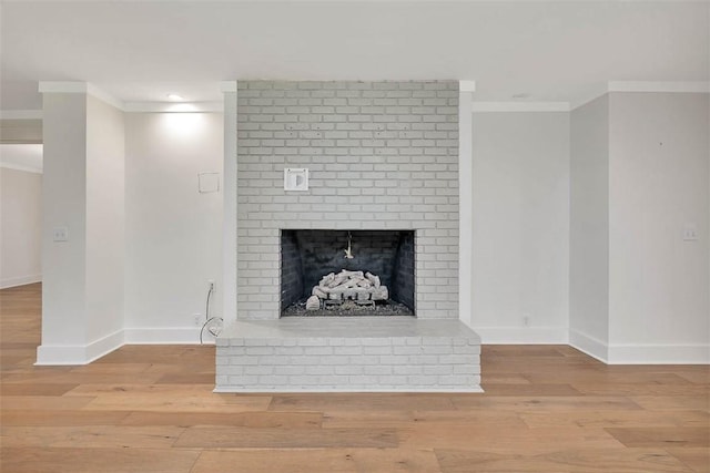 111 Youngwood Dr, Saint Simons Island, GA 31522 - detailed view of ornamental molding, a fireplace, wood finished floors, and recessed lighting