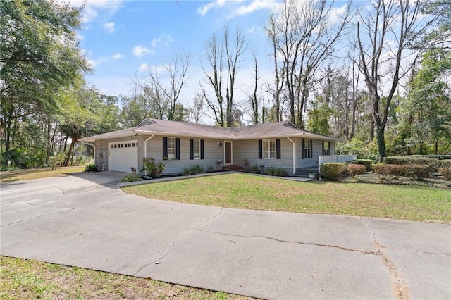 ranch-style house with a front yard, concrete driveway, and an attached garage