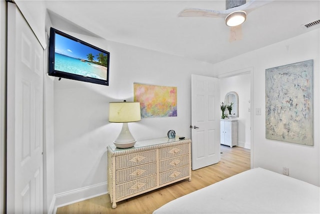 bedroom featuring hardwood / wood-style flooring and ceiling fan