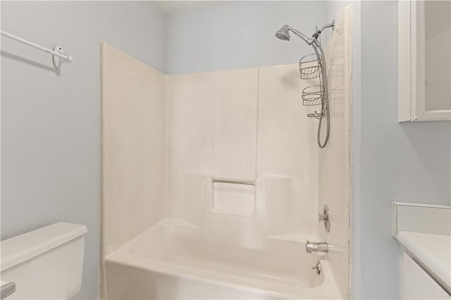 bathroom with toilet and washtub / shower combination