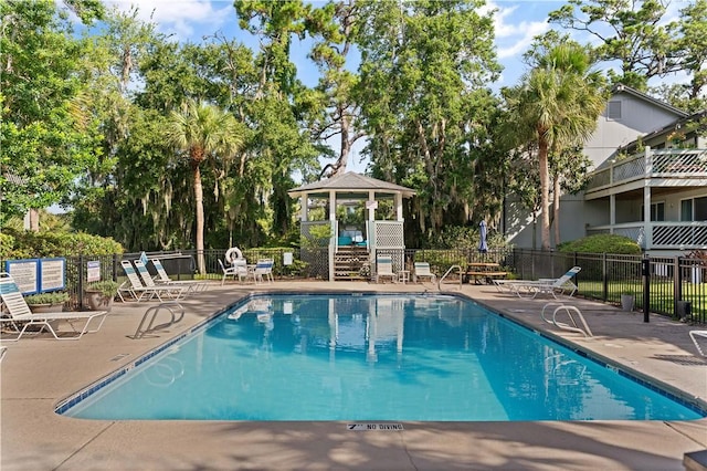 view of pool featuring a gazebo and a patio area