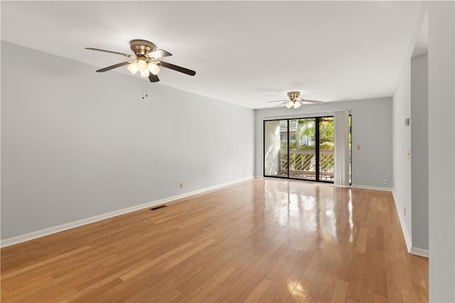 unfurnished room featuring ceiling fan and light hardwood / wood-style flooring