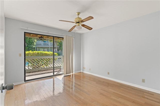 spare room featuring light hardwood / wood-style flooring and ceiling fan