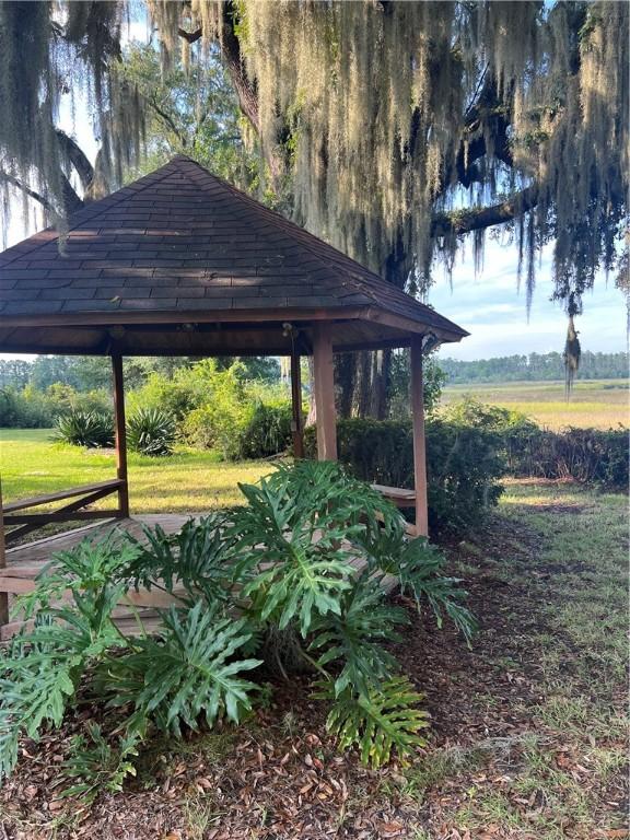 view of community featuring a gazebo and a yard