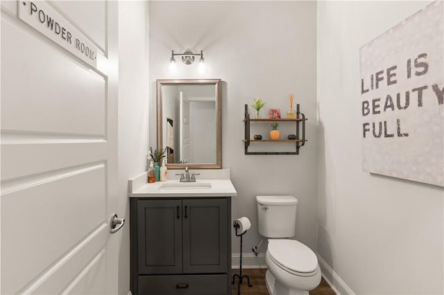 98 Bartram Trl, Brunswick, GA 31523 - half bath with toilet, vanity, and baseboards