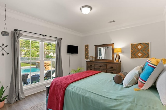 98 Bartram Trl, Brunswick, GA 31523 - bedroom with ornamental molding and wood finished floors