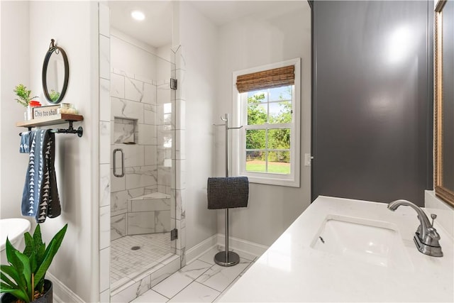 98 Bartram Trl, Brunswick, GA 31523 - bathroom featuring a sink, baseboards, marble look tile flooring, and a shower stall