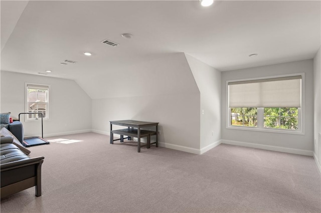 98 Bartram Trl, Brunswick, GA 31523 - carpeted living area featuring baseboards, vaulted ceiling, and recessed lighting
