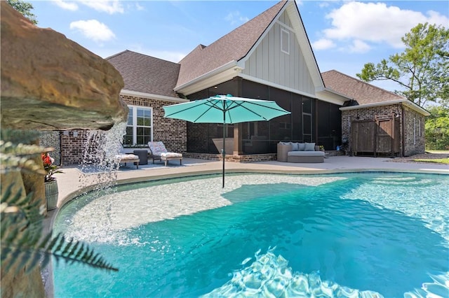98 Bartram Trl, Brunswick, GA 31523 - swimming pool with a sunroom and a patio
