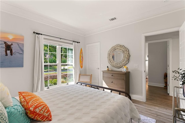 98 Bartram Trl, Brunswick, GA 31523 - bedroom featuring ornamental molding, wood finished floors, and baseboards