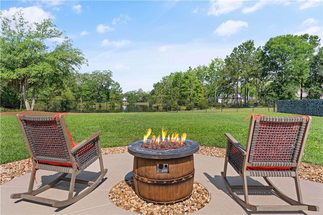 98 Bartram Trl, Brunswick, GA 31523 - view of patio / terrace with a fire pit and view of scattered trees